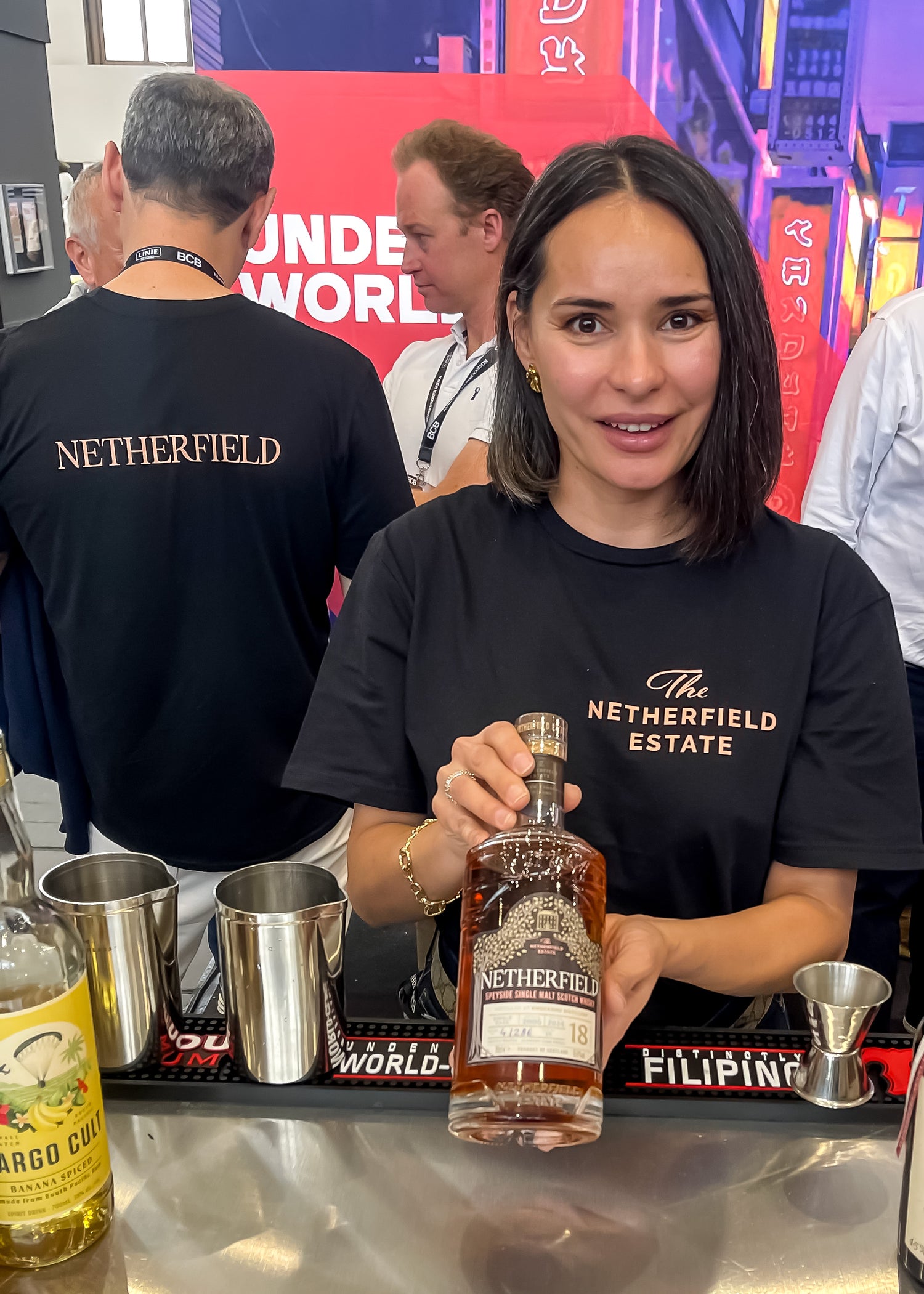 Radmila's holding a sample bottle of Netherfield Single Cask Knockdhu 18 years old